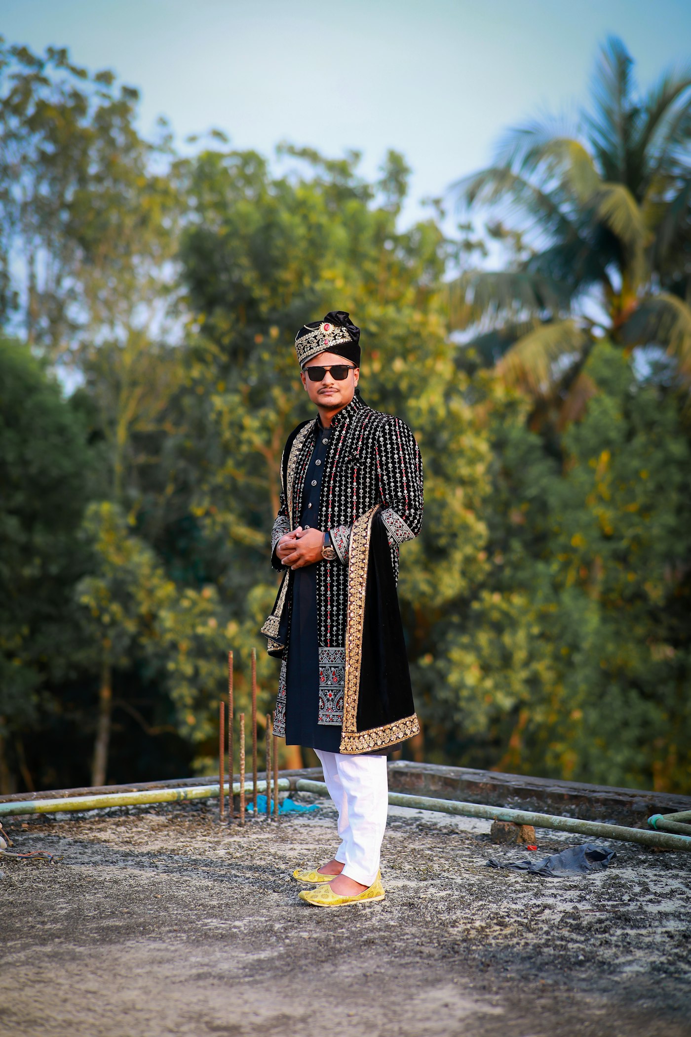 Black silk kurta under an embroidered velvet stole